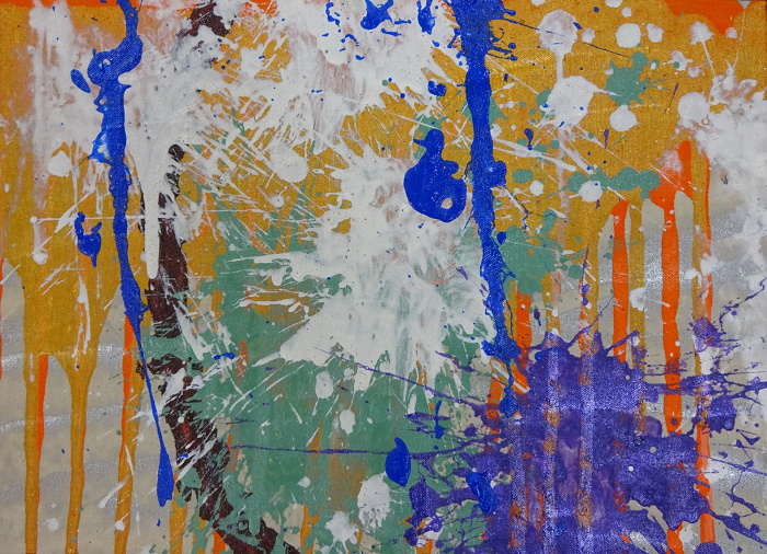 Silver canvas with drips of orange and splashes of purple, white, turquoise, and blue in the forefront.