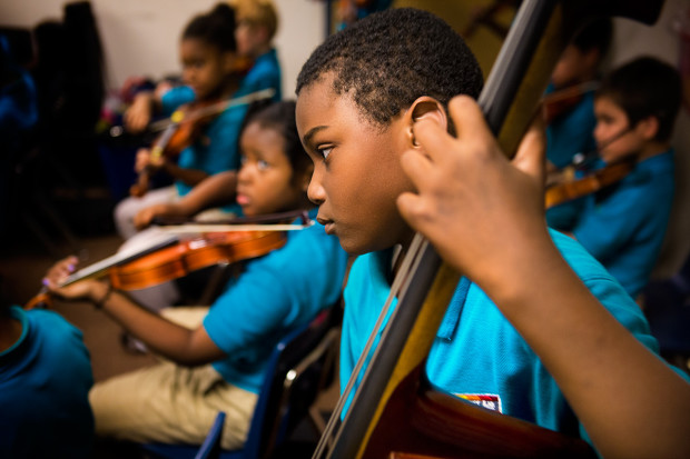 Children playing string instruments