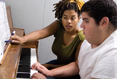 Music Teacher with Piano Student on the Autism Spectrum