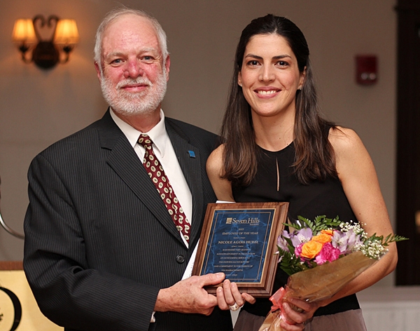 Charles Washburn presenting Employee of the Year plaque to Nicole Agois Hurel