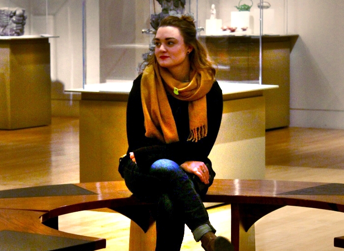 Emily Frank sitting in a museum