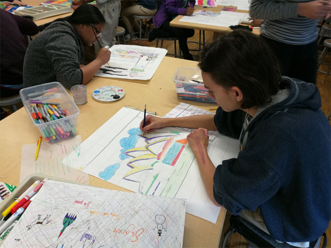 Students painting in class