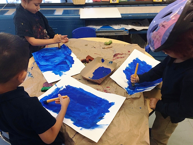 Henderson K2 class students hard at work painting their backgrounds