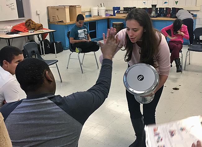 Allie teaching music to students