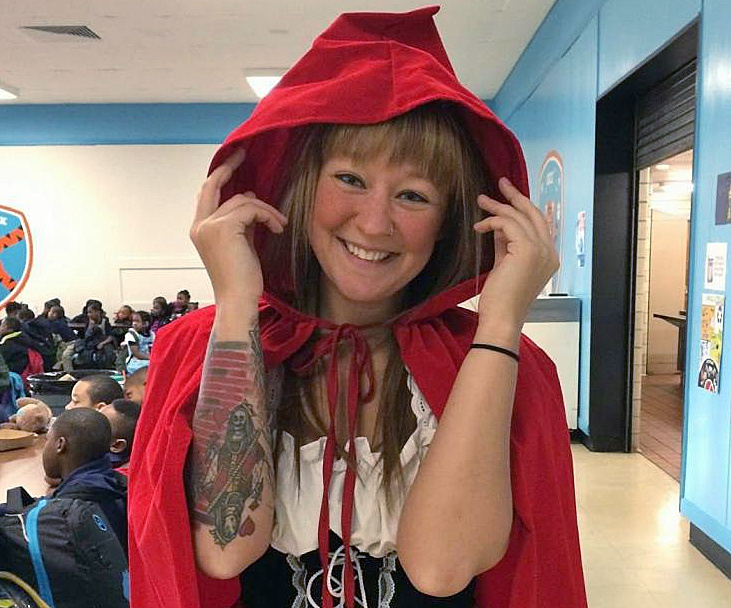 Stephanie Nikolaou wearing a red hood and smiling.